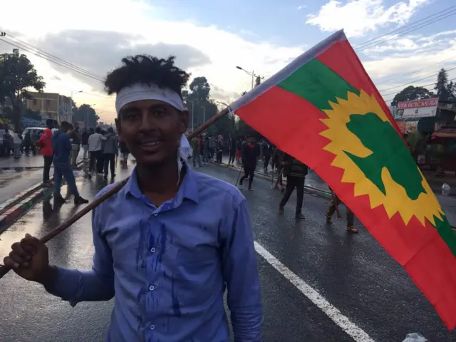 OLF supporter with flag