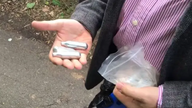 A hand with some of the latest canisters found in Worcestershire