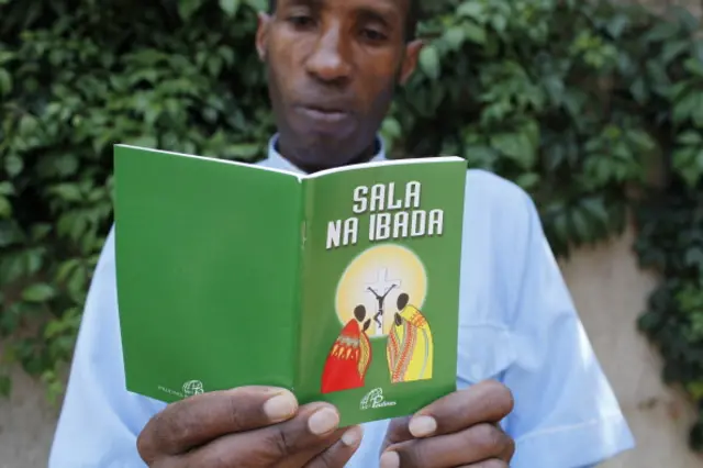 Kenyan man reads book