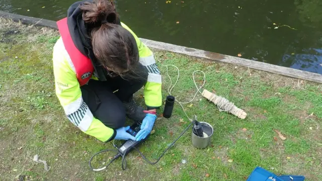 A woman testing the water