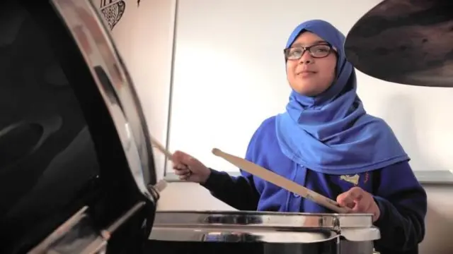 Pupil playing drums