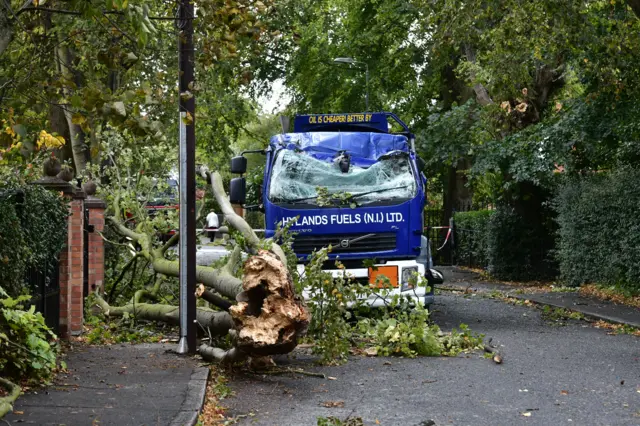 Lorry damaged by fallen trees during Storm Ali