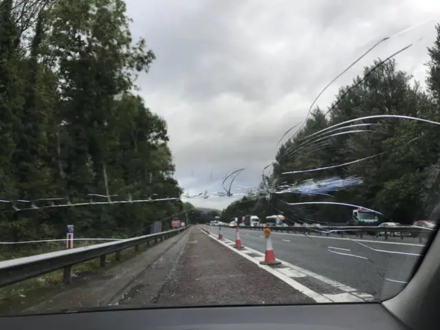 Cracked windscreen because of fallen power cable