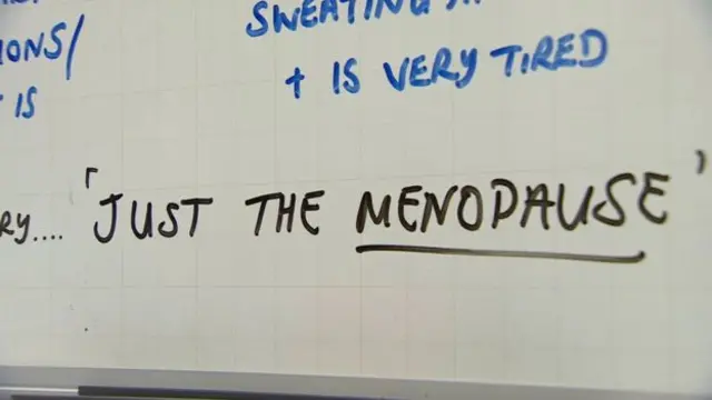 Whiteboard with 'just the menopause' written on it