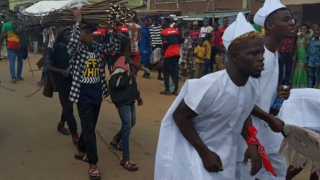 Men carry canes at the New Yam Festival in Ilara-Mokin, Nigeria