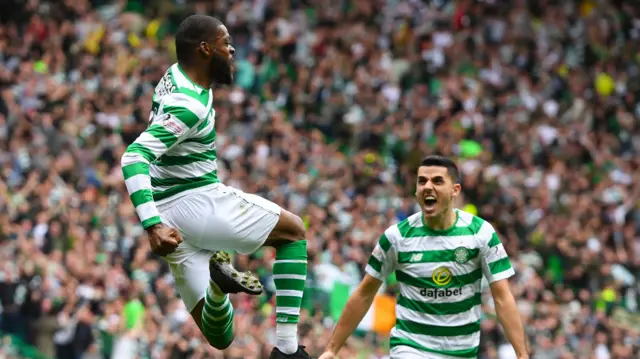 Olivier Ntcham (left) and Tom Rogic celebrate the Celtic goal