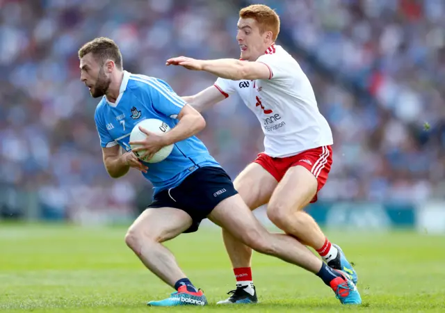 Jack McCaffrey and Peter Harte in action in a keenly contested first half