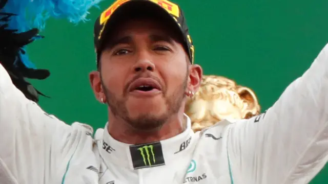 Lewis Hamilton celebrates winning the Italian GP