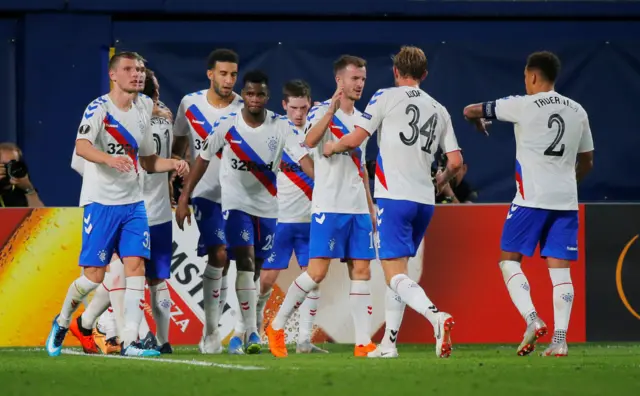 Scott Arfield celebrates with teammates