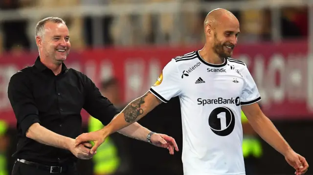 Rosenborg coach Rini Coolen congratulates Issam Jebali