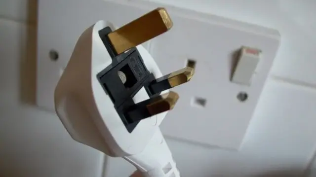 A UK electrical plug socket and plug