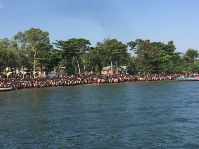 People lining the shore