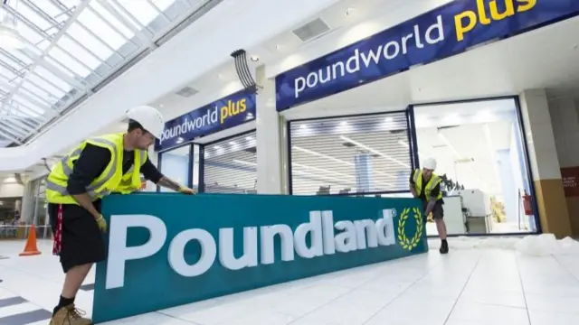 A Poundland sign going on a Poundworld