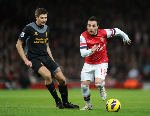 Santi Cazorla in action against Steven Gerrard