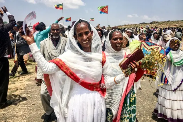 Eritrean women express their joy after crossing the boarder to attend the reopening border ceremony on September 11, 2018