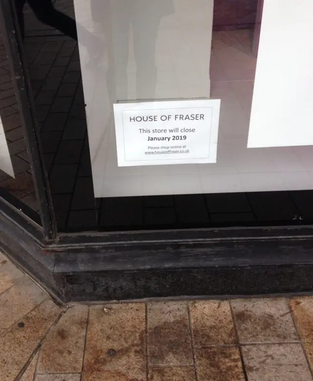 Sign on House of Fraser building confirming closure date