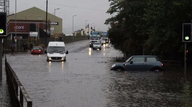 A car and van in flood waters