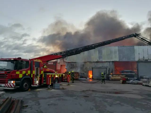 Firefighters deal with the fire