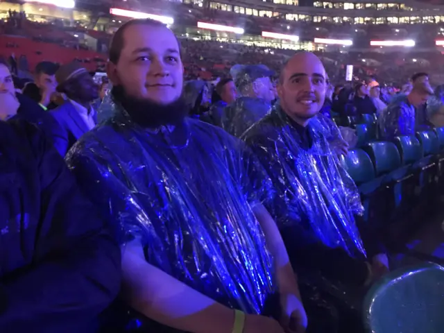 Fans in ponchos