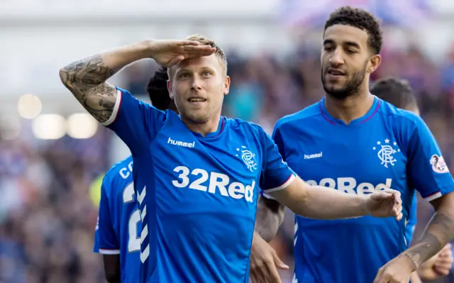 Scott Arfield salutes the crowd