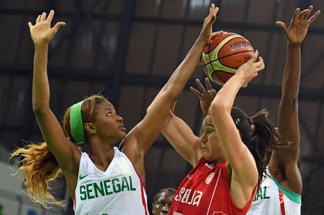 Senegal's shooting guard Oumoul Thiam blocks her opponent