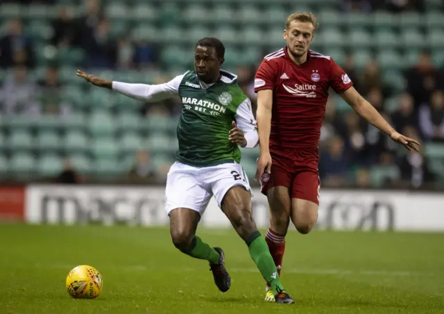 Hibernian's Efe Ambrose holds off Aberdeen's James Wilson