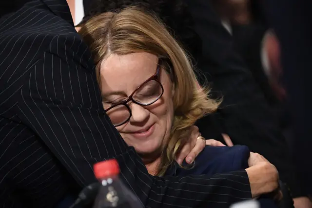 Ford hugs her lawyer