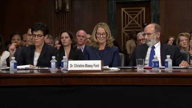 Ford flanked by her two lawyers