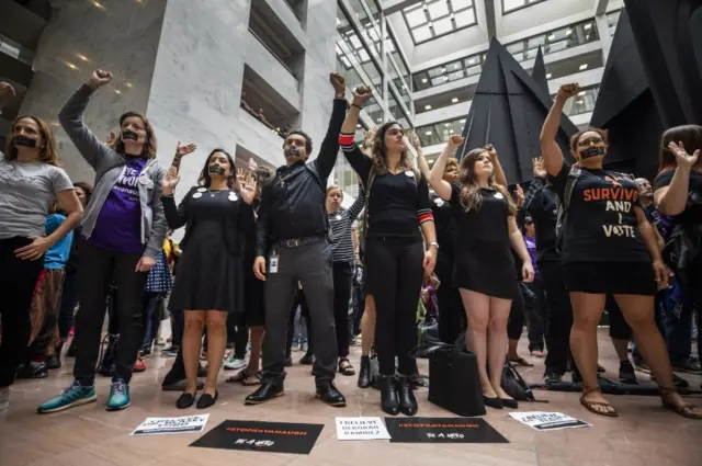 Protestors gather inside the Hart Senate Office Building as Supreme Court nominee Brett Kavanaugh and Christine Blasey Ford, one of the women accusing him of sexual assault, testify on Capitol Hill