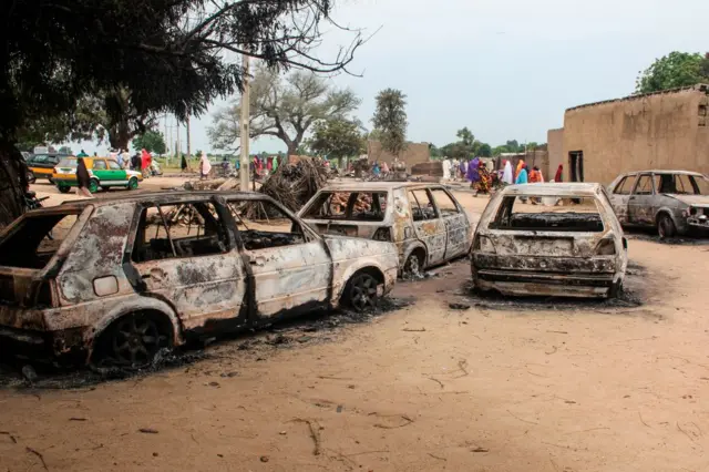 The wreckage of cars damaged by an attack on a market are seen on September 20, 2018, in Amarwa, some 20 kilometres (12 miles) from Borno state capital Maiduguri.