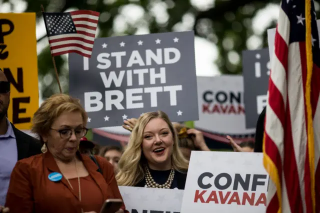 Pro-Kavanaugh protesters with 'I STAND WITH BRETT' signs