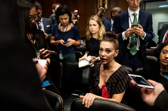 Alyssa Milano sits in hearing room