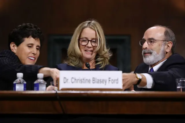 Ford's lawyers help move her microphone closer to her face