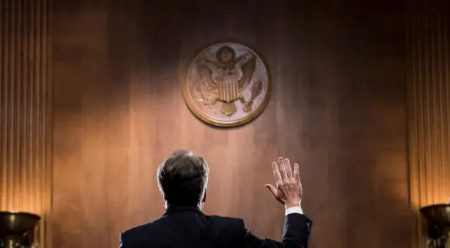 Kavanaugh being sworn in