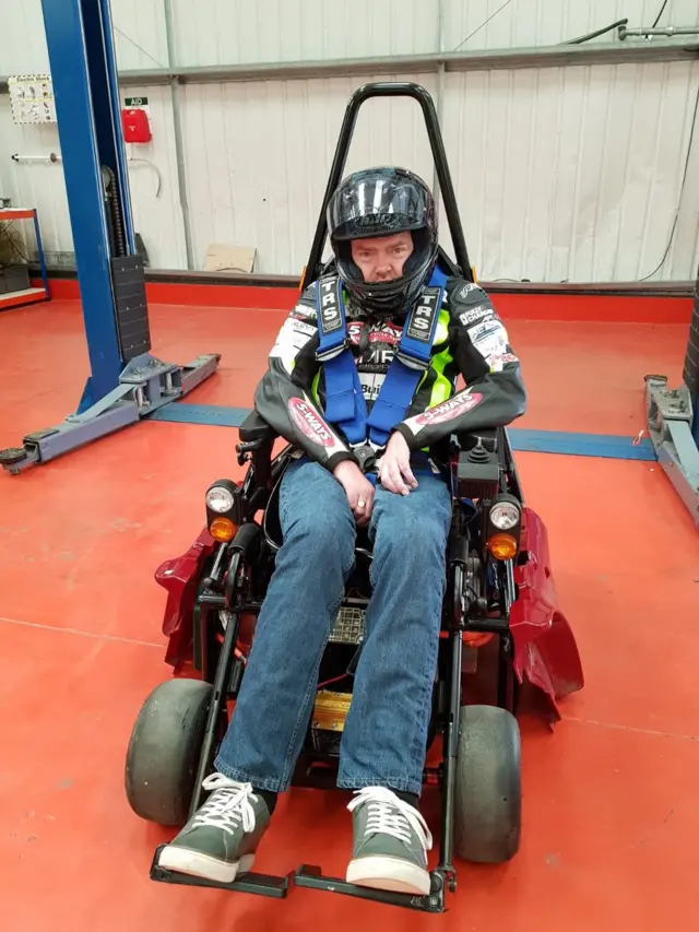 Jason Liversidge in a specially adapted wheelchair