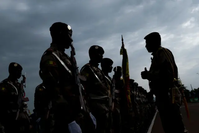 Malian army soldiers get ready ahead of the National Day military parade on September 22, 2018 in Bamako, Mali