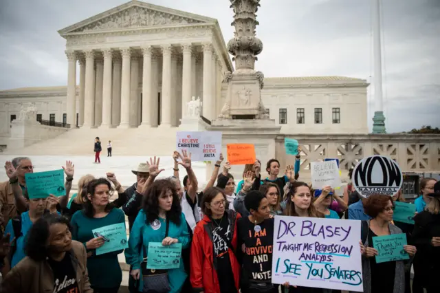 Protesters rally against Supreme Court nominee Judge Brett Kavanaugh outside the Supreme Court.