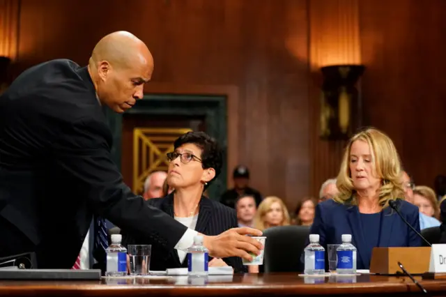 Booker brought her a cup of coffee earlier in the hearing