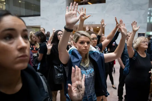 Protestors rally against Supreme Court nominee Judge Brett Kavanaugh inside the Hart Senate Office Building.