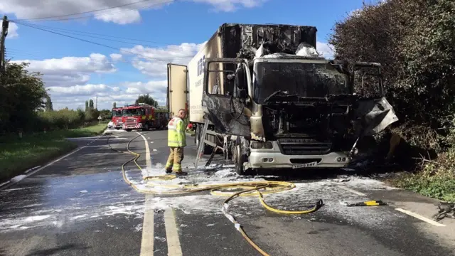 Firefighters by lorry