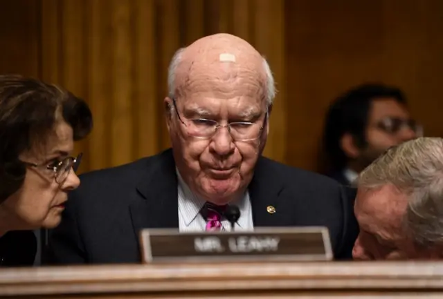 Senate Judiciary Committee ranking member Senator Dianne Feinstein (left) speaks with Patrick Leahy (centre) and Dick Durbin (right).