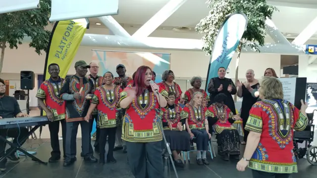 Choir performing at Manchester Airport