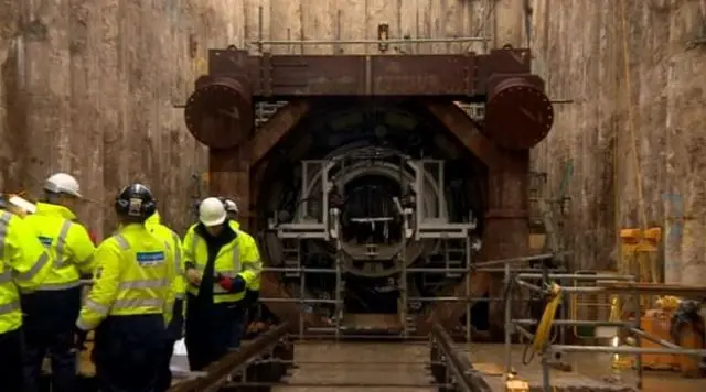 The mouth of the tunnel and the boring machine.