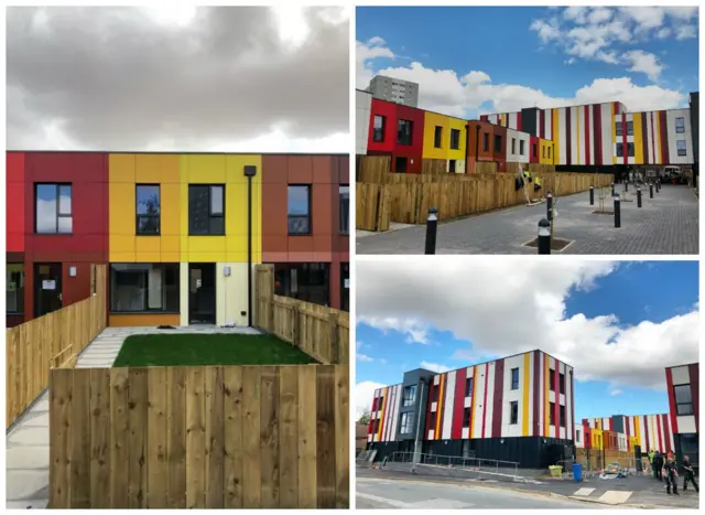 Flats and houses painted in bright stripes of colour.