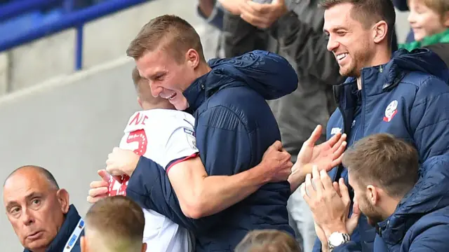 Craig Noone hugs Stephen Darby