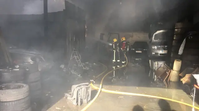 Fire crews inside the unit