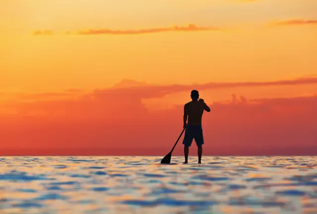 Man paddleboarding