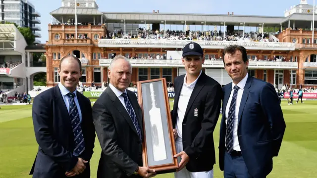 Alastair Cook with his commemorative bat at Lord's