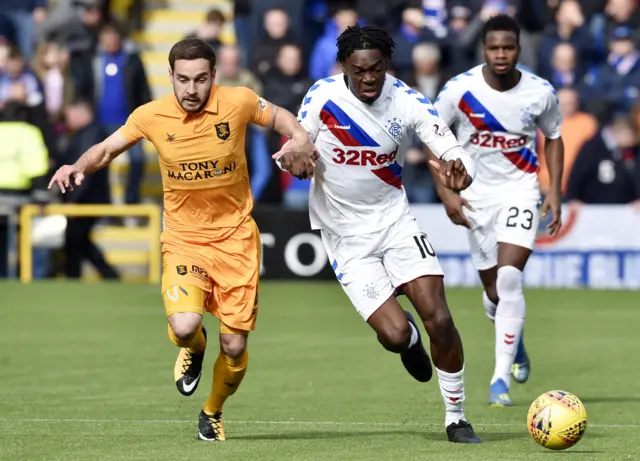 Liivngston’s Scott Pittman (left) and Rangers’ Ovie Ejaria tussle for possession