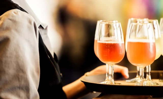 Waiter serving drinks